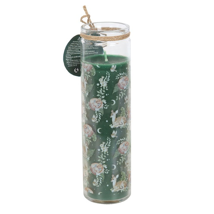 Decorative candle with floral and animal pattern in a glass holder on a white background